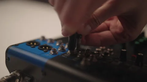 Close-up of sound engineer connecting multiple jack cables into audio mixing Stock Footage 324865456