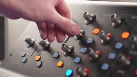 Close Up Sound Engineer Hand Adjusts Mixing Console Studio Radio Control Stock Footage 329276435