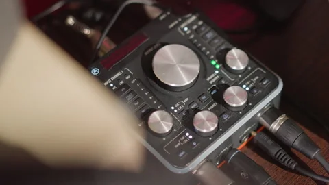 Close-Up of Sound Mixer with Knobs and Dials in a Recording Studio 스톡 동영상 283136204