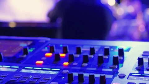 A close-up of a sound mixing console, featuring various knobs 스톡 동영상 305191036
