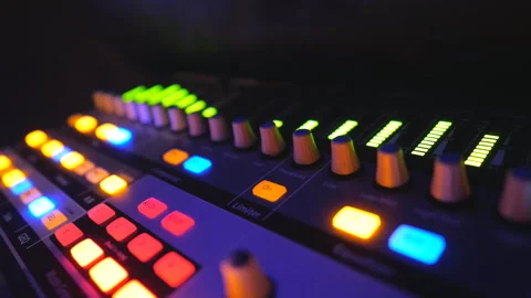 Close up of soundboard with knobs and green color equalizer in night club. Audio 스톡 동영상 288962911