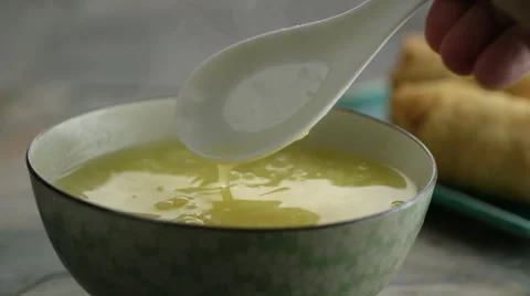 Close-up of soup being mixed with spoon Stock Footage 46667689