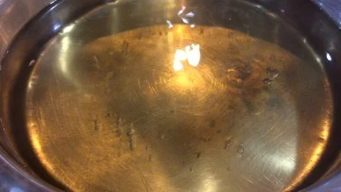 Close up soup boiling water bubble in pan on electronic stove Stock Footage 88649739