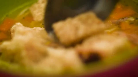 Close up, soup with pieces of bread soaking up the soup Stock Footage 232337973