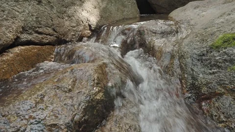 Close up source of clear water between stones, loop. Thailand Stock Footage 332452189