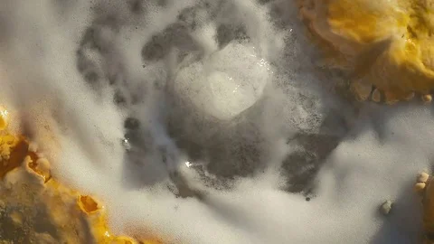 Close up source of mineral water flows out of the ground in slow motion. Video stock 84272814