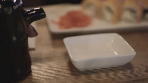Close-up of soy sauce being poured into bowl. Stock Footage 87917012