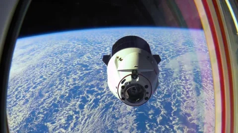 Close-Up of a Spacecraft with Astronauts Approaching a Space Station 库存影片 262556715