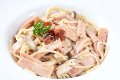 Close up spaghetti carbonara which has mushrooms, ham and black pepper mix an Stock Photos