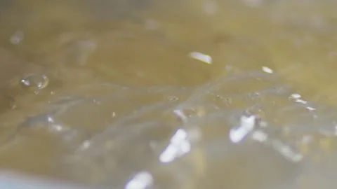 Close-up of spaghetti pasta In boiling hot water in steel pan. preparation for Video stock 144677287