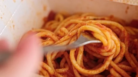 Close up of spaghetti pasta with red tomato sauce on a fork in box Stock Footage 149117275
