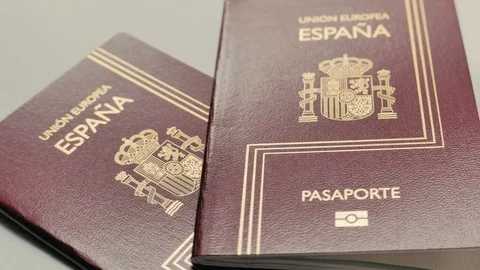 Close-up of spanish passports rotating Stock Footage 101371512