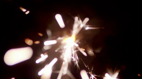 Close Up Sparkler Light Burning Spark Light Fire Background Holiday Celebrate Video stock 144802369