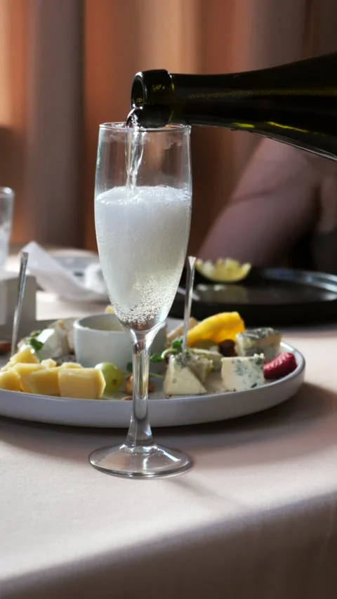 Close-up sparkling champagne being poured into glasses Stock Footage 313239240