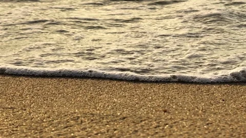 Close-up of sparkling sand and waves at the shoreline. Stock Footage 308608449