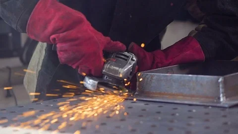 Close-up. Sparks from angular grinding machine fly into camera. Super slow Vídeo Stock 73804690