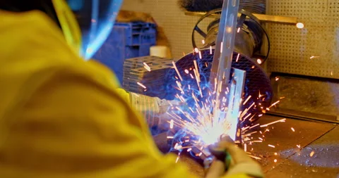 Close-up, sparks are flying when welding metal. Spot welding of metal parts in Stock Footage 142834908