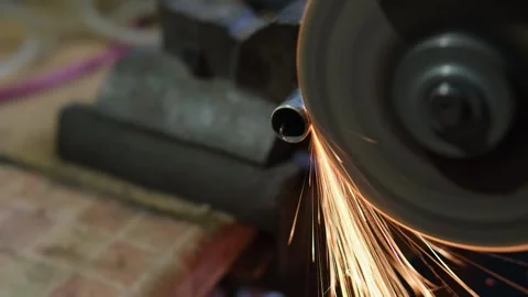 Close-up of sparks from rotating abrasive wheel, abstract energy, friction and Stock Footage 324817415