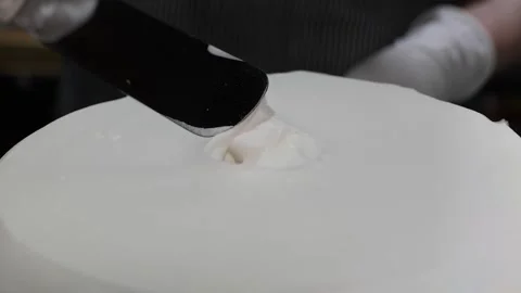 Close-up of Spatula Smoothing Thick White Cream Texture Stock Footage 331777228