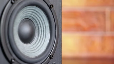 Close-up of speaker cone vibrating with heavy bass Видео 334322439