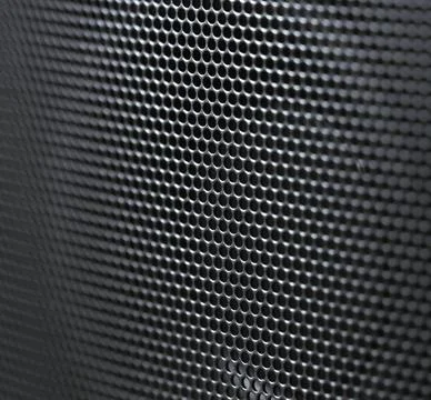 Close-up speaker grid with partially blurred field Stock Photos