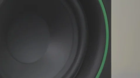 Close up of a speaker woofer bouncing from audio Video stock 89799722