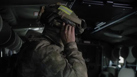 Close-up,  special forces soldier in an armored military vehicle Stock Footage 327353210
