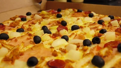 Close-up of a special knife cuts the hot pizza Stock Footage 70817886