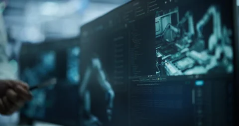 Close Up Specialists Discussing Robotic Arms on Screen Stock Footage 319830348