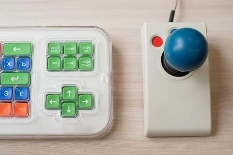 Close-up of a specialized computer mouse and keyboard for people with cerebral 스톡 사진