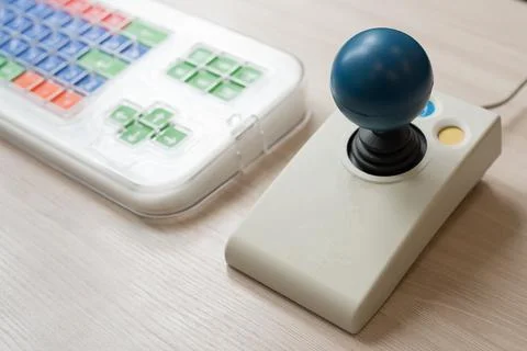 Close-up of a specialized computer mouse and keyboard for people with cerebral Foto stock