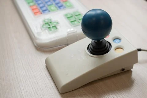 Close-up of a specialized computer mouse and keyboard for people with cerebral Foto stock