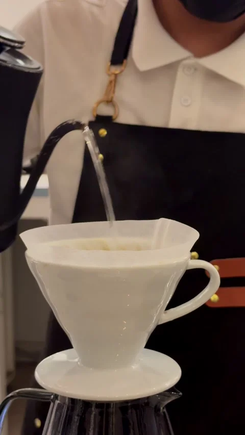 Close up of specialty coffee brewing process using two V60 ceramic drippers Stock Footage 337636012