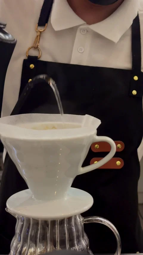 Close up of specialty coffee brewing process using two V60 ceramic drippers Stock Footage 337636032