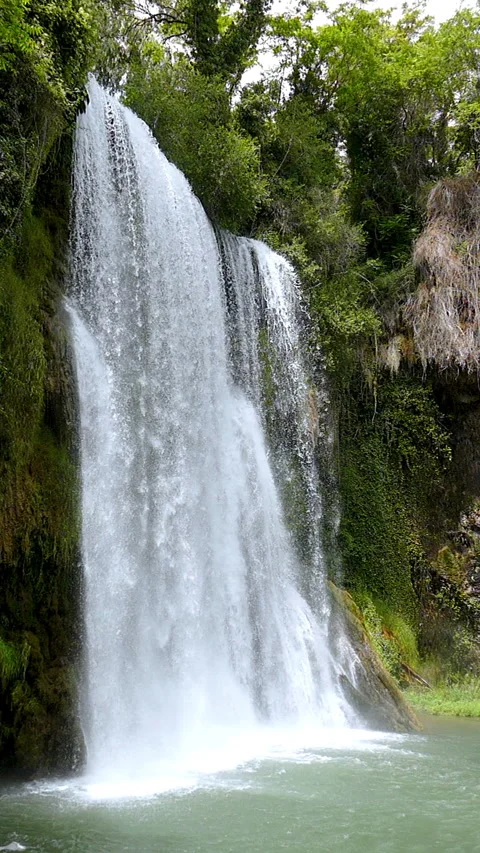 Close-up of a spectacular waterfall. Video in vertical format. Slow Motion. Stock Footage 290518260