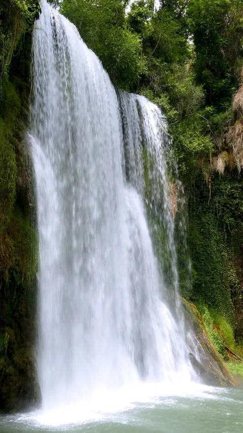 Close-up of a spectacular waterfall. Video in vertical format. 4K. Stock Footage 290518357