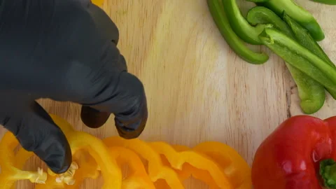Close up Speed Top-view. Decorating yellow bell pepper and having green Stock-Footage 136807098