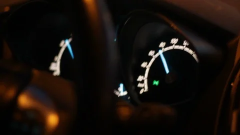 Close up of speedometer. Hurrying because of being late. Flashlights outside. Stock Footage 90840918