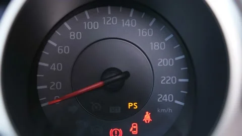 Close-up. The speedometer panel lights up. The red arrow rises to the maximum Stock-Footage 100399448