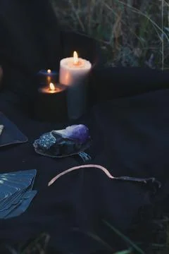 Close up spell casting with crystals and candles concept photo Stock-Fotos