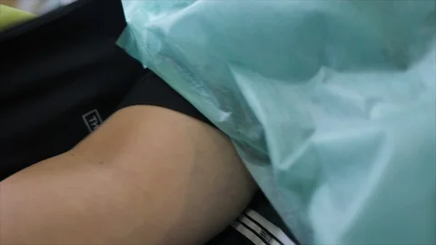 Close Up of sphygmomanometer inflatable cuff being removed Video stock 120541365