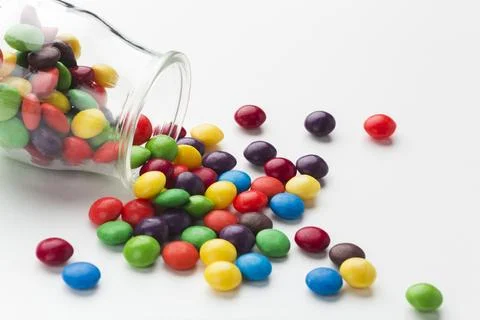 Close up spilled candy jar Stock-Fotos