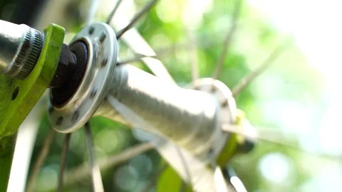 Close-up Spin the bicycle spokes rotation of the front wheel  Video stock 127484276