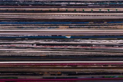 Close-up of the spines of multi-colored covers of old vinyl records, which ar 写真素材
