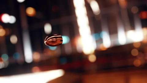 Close-Up of a Spinning Bullet in Motion , Slow Motion Bullet in Travel Stock Footage 304741968