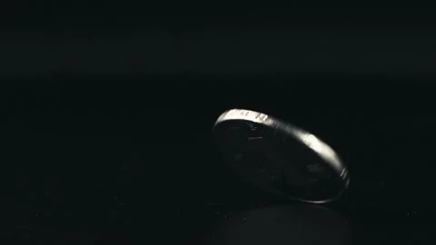 Close-up A spinning coin Stock Footage 234191753