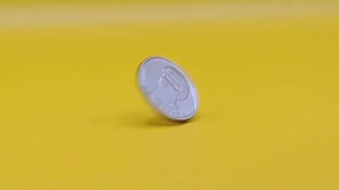 Close-up of a spinning coin. Stock Footage 333915153