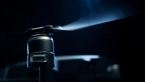 Close-up spinning drone propellers on black background Stock Footage 125897271