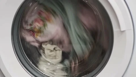 Close-up of spinning drum laundry machine. Video stock 168415502