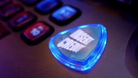 Close up spinning insert credit button on slot machine inside Hard Rock Casino Stock Footage 75302881